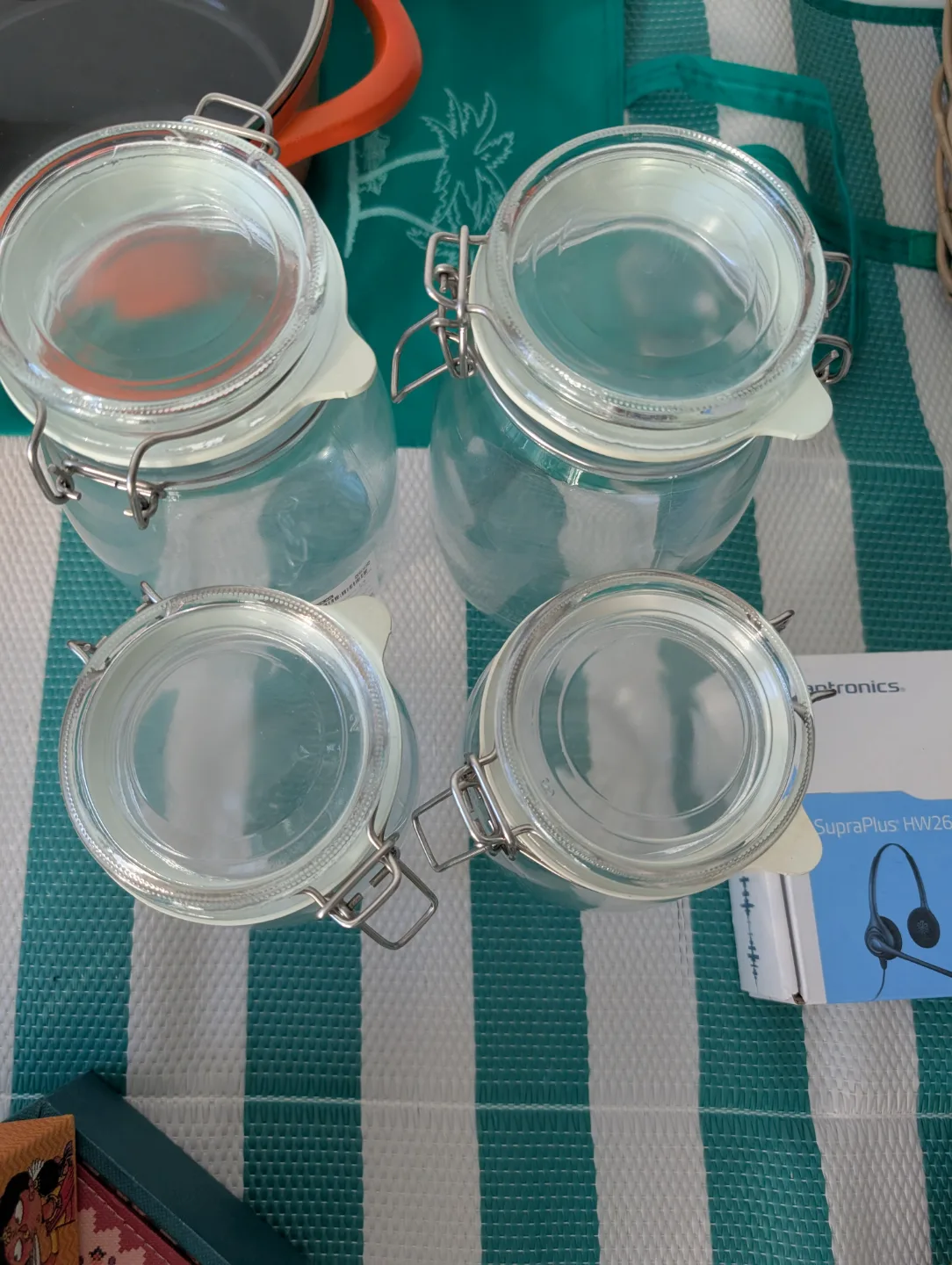 Set of four glass storage jars with metal lids thumbnail