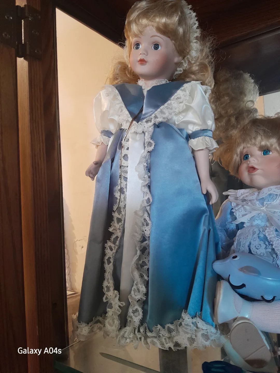 Porcelain Collectible Doll in Blue Gown image indicator(2)
