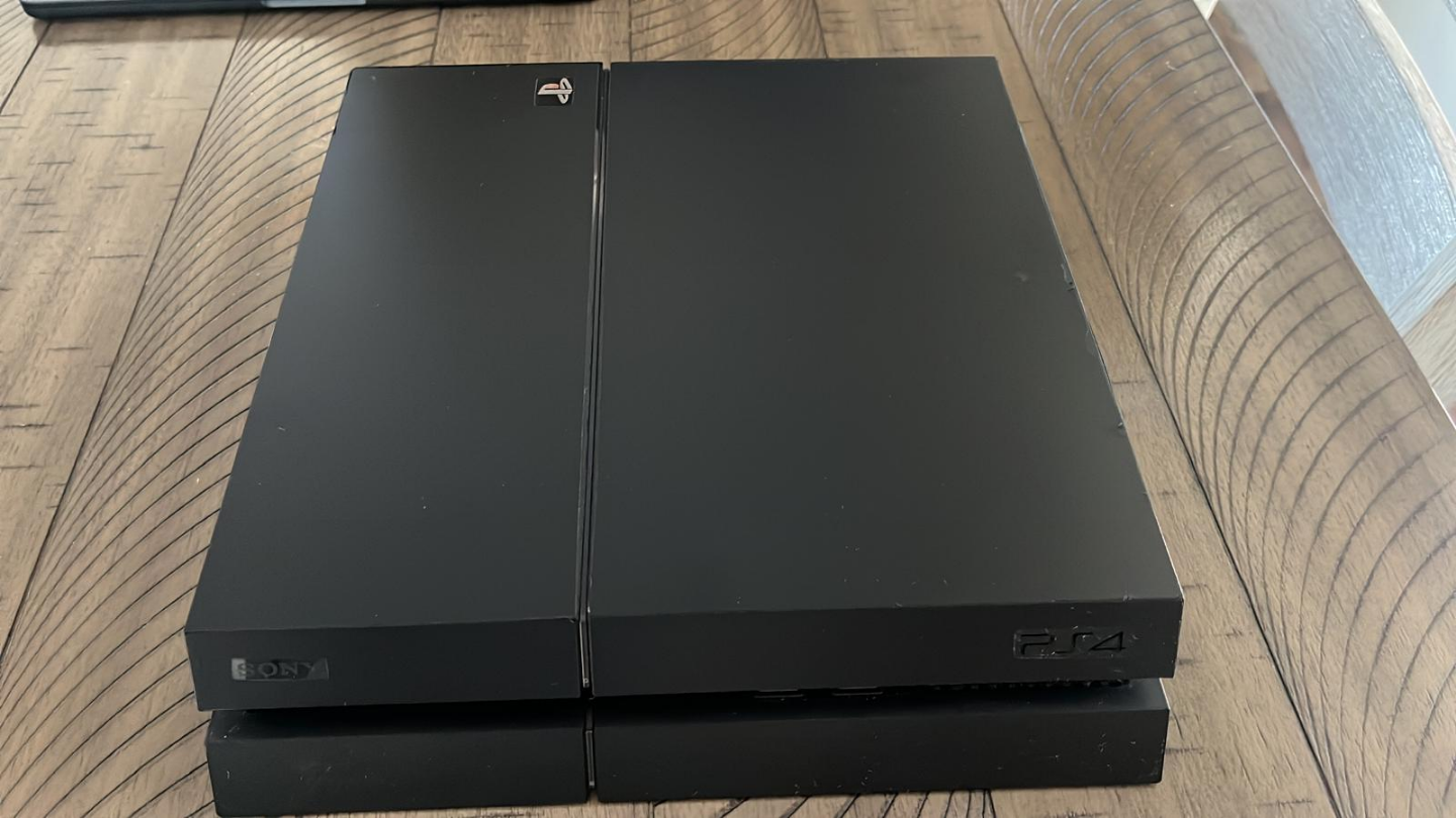 PlayStation 4 with two controllers