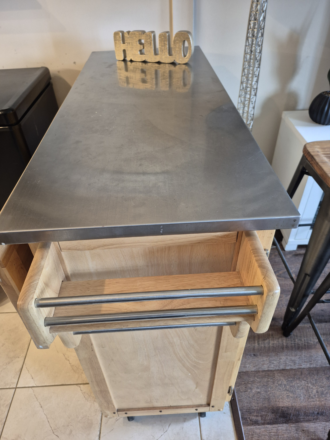 Wood and stainless steel island with stools.