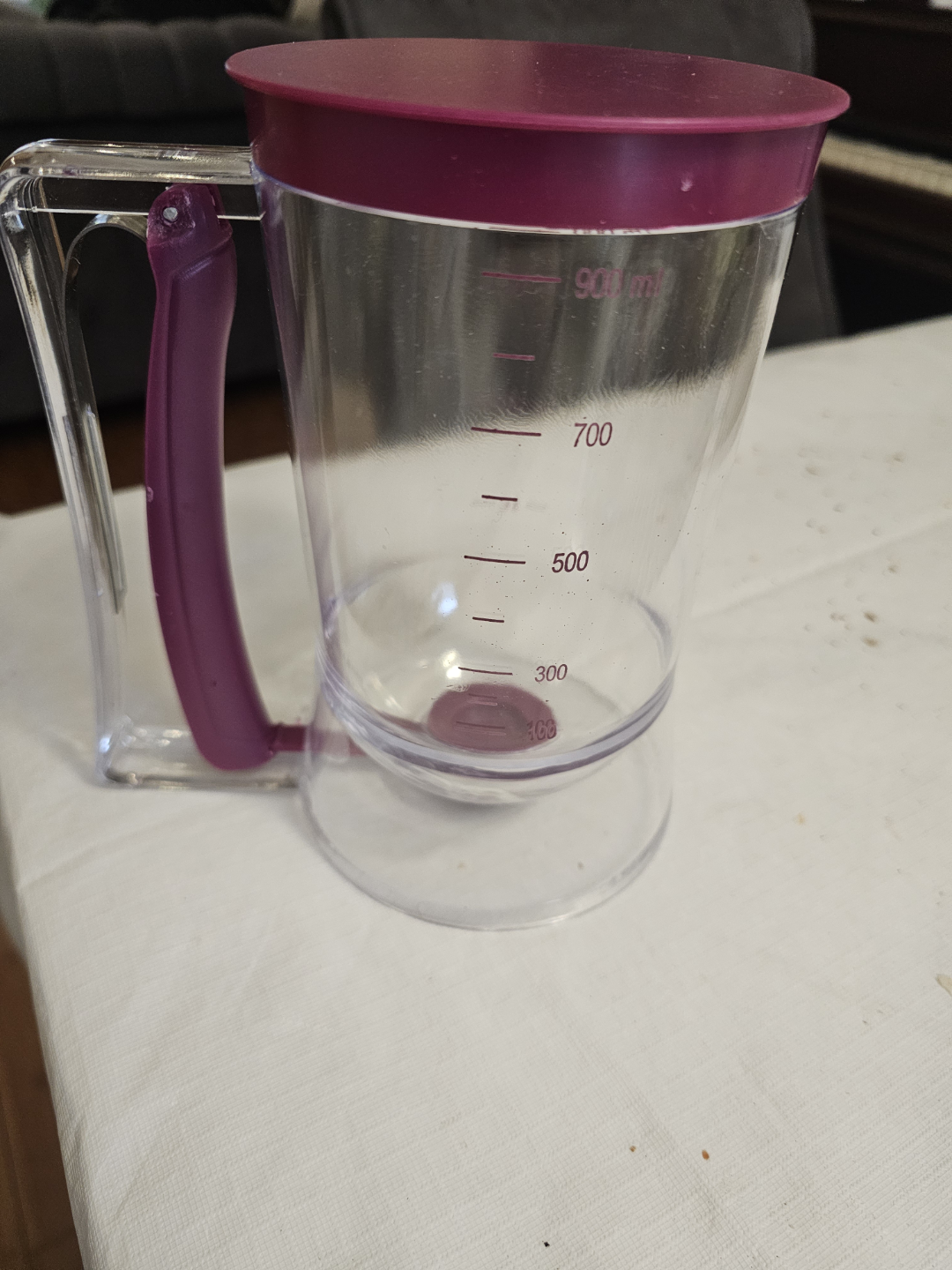 Clear Plastic Batter Dispenser with Purple Lid and Handle