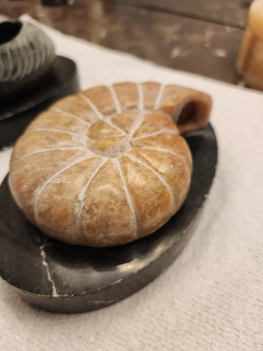 Two Carved Stone Sculptures on Marble Bases image indicator(4)