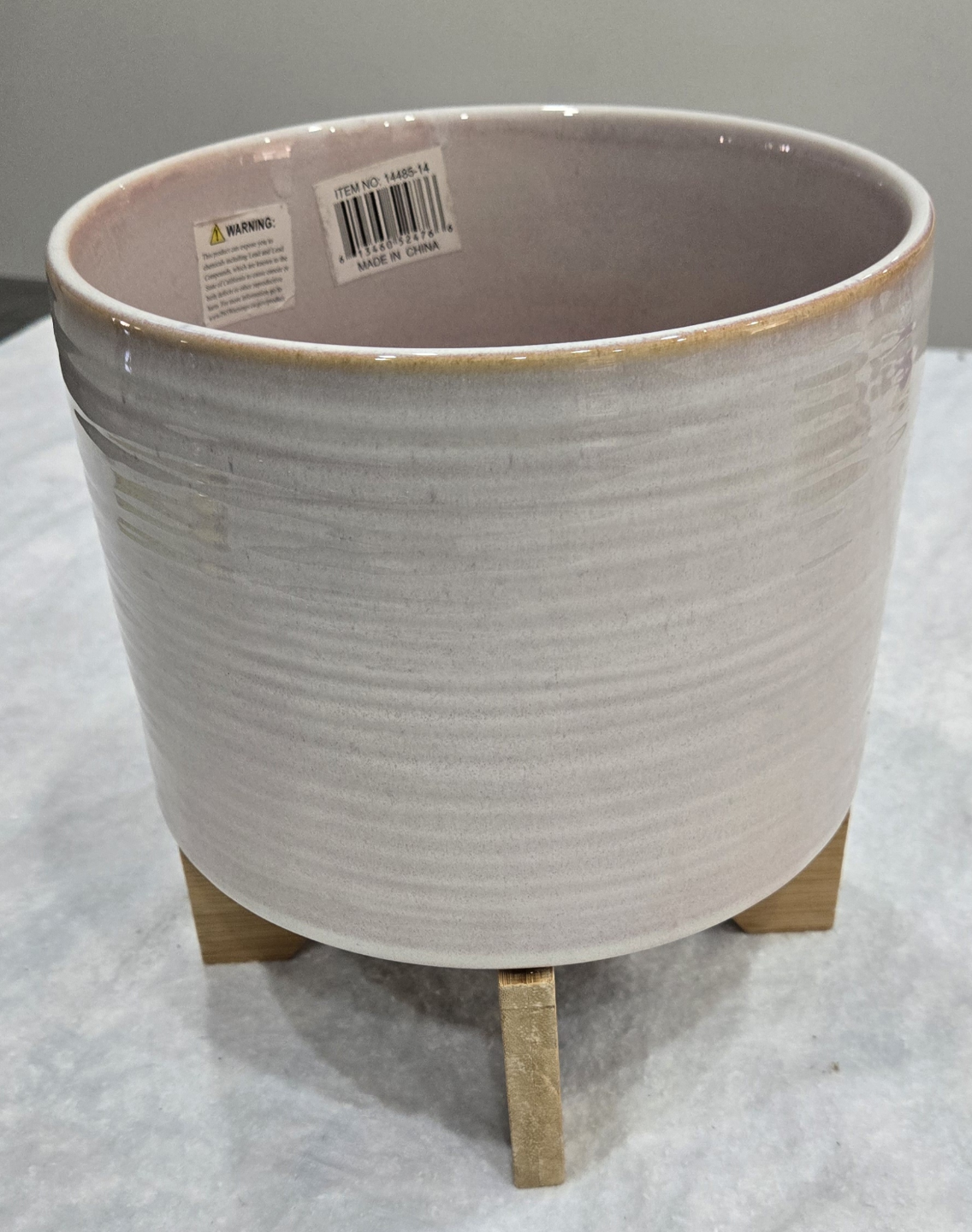Unique ceramic planter with wooden stand