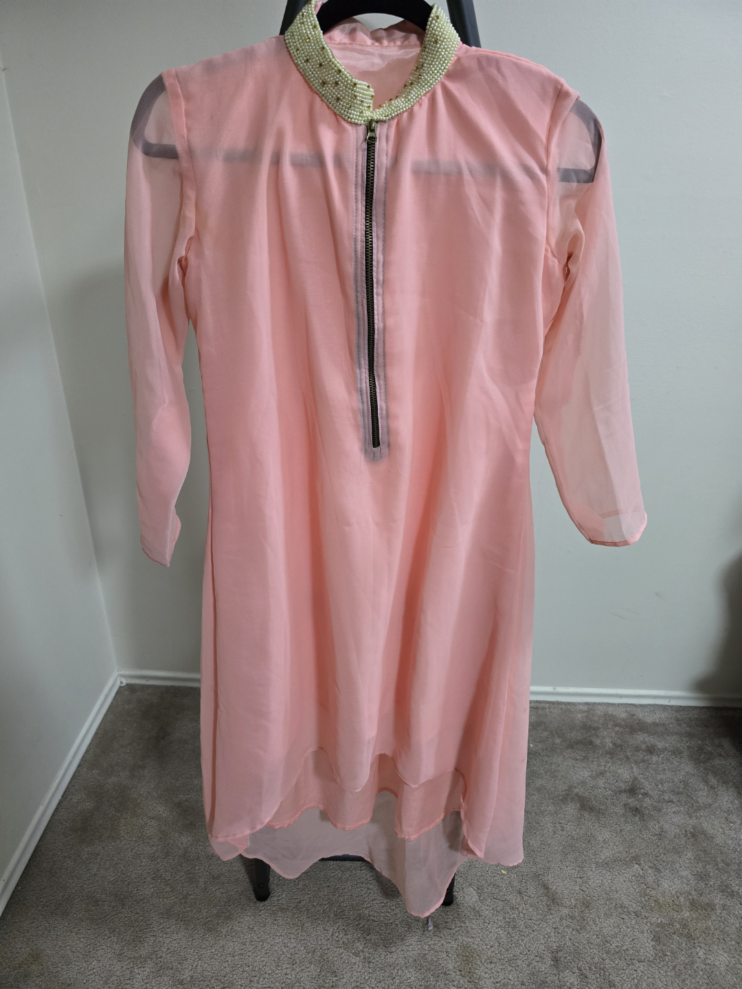 Peach coloured two-piece suit