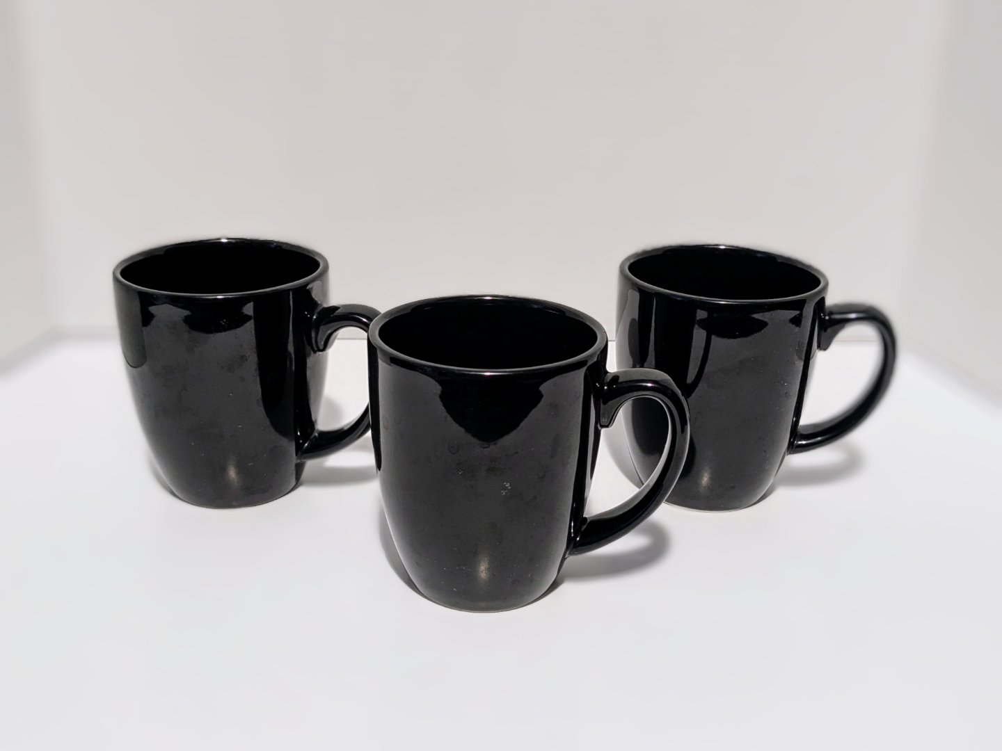 Set of three Corelle Coordinates black mugs