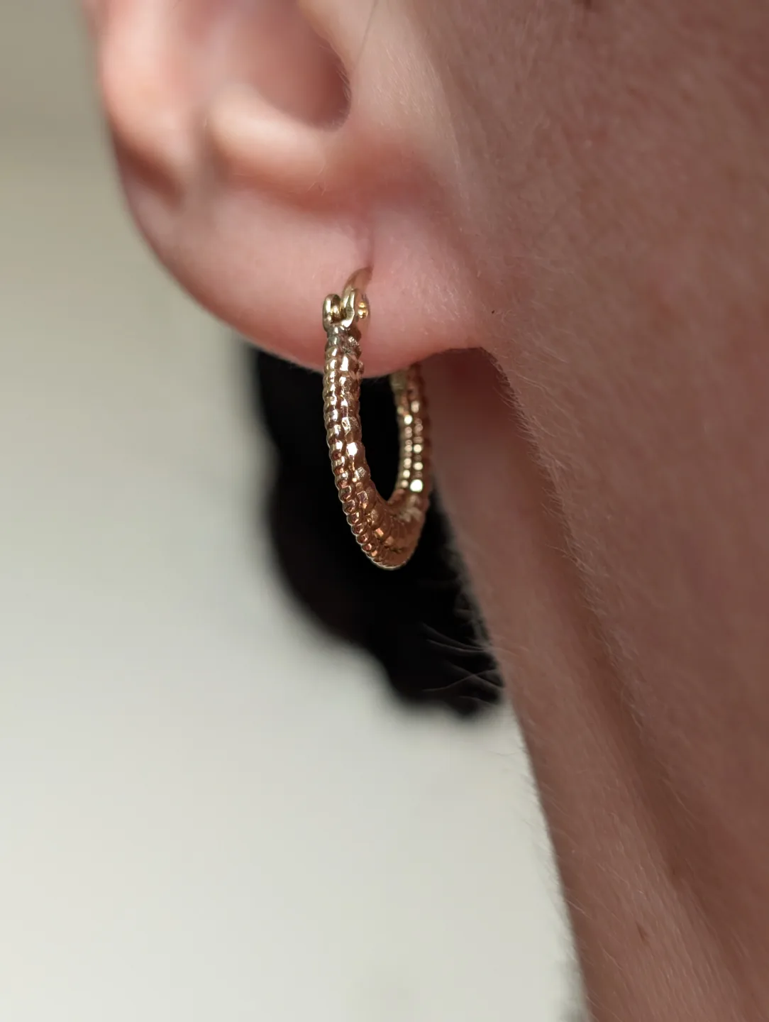 Small Gold Tone textured hoop earrings image indicator(9)