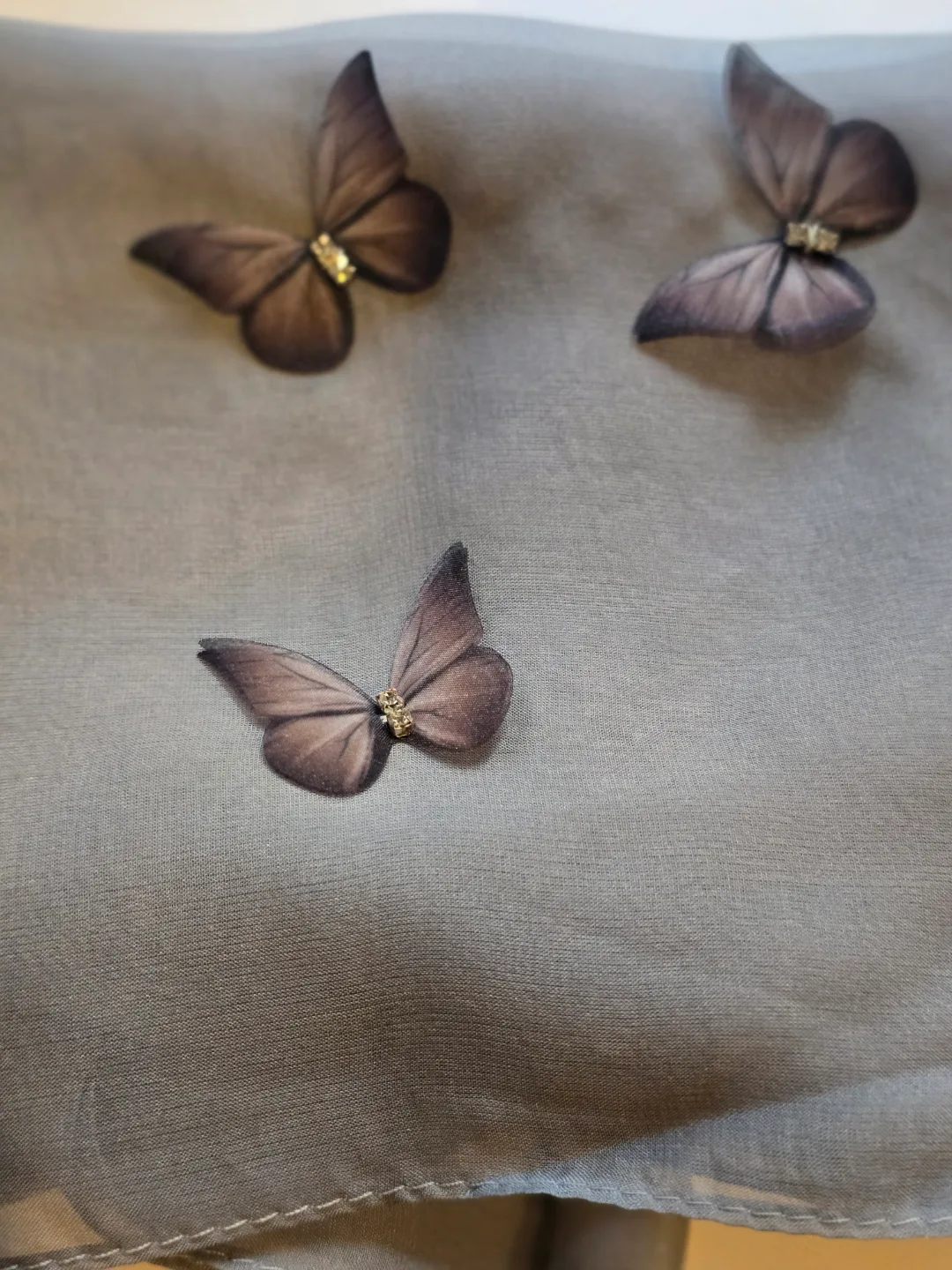 Grey silk scarf with butterfly accents thumbnail