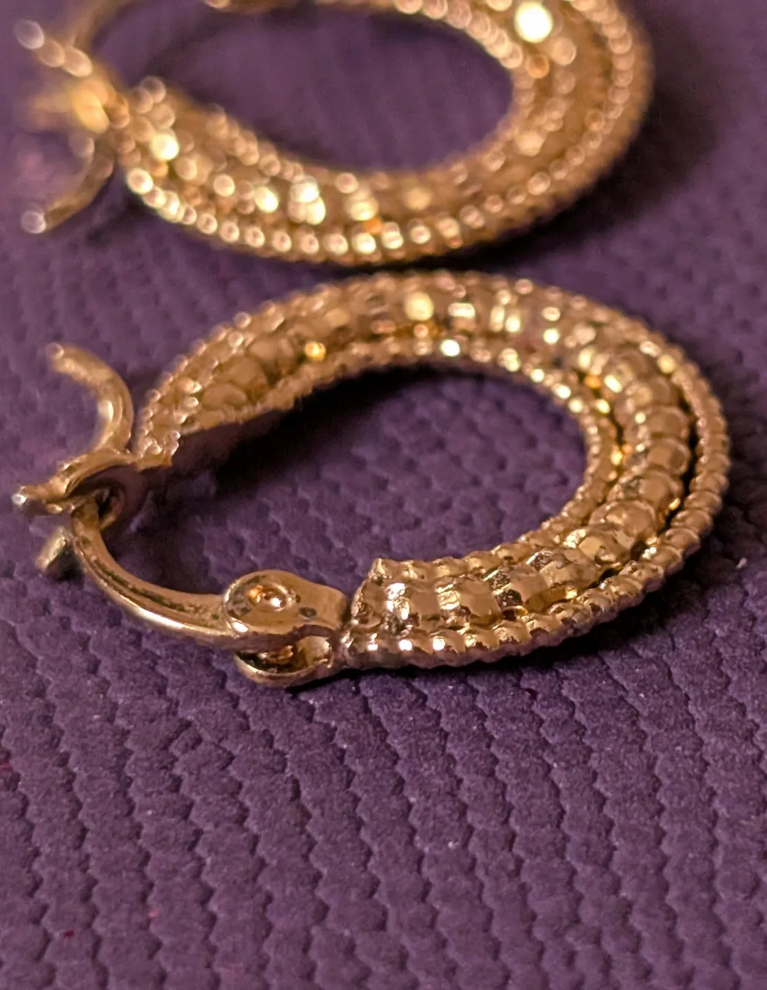 Small Gold Tone textured hoop earrings image indicator(2)