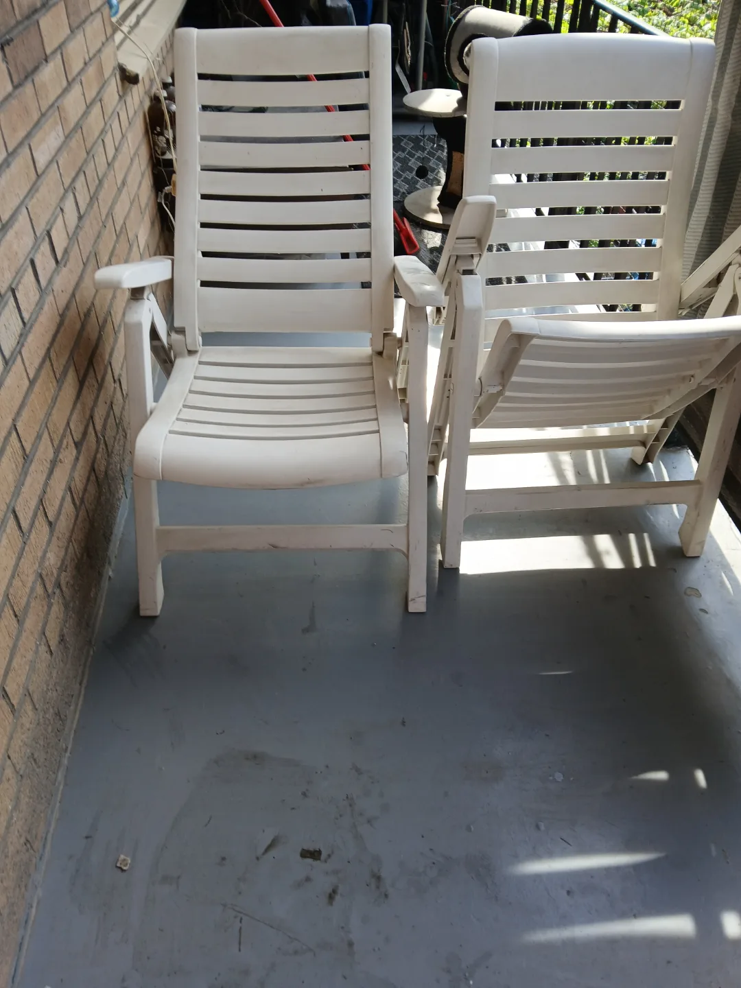 Pair of White Plastic Folding Lounge Chairs image indicator(3)