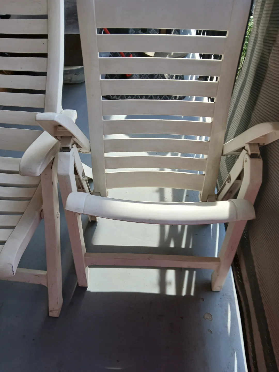 Pair of White Plastic Folding Lounge Chairs image indicator(4)