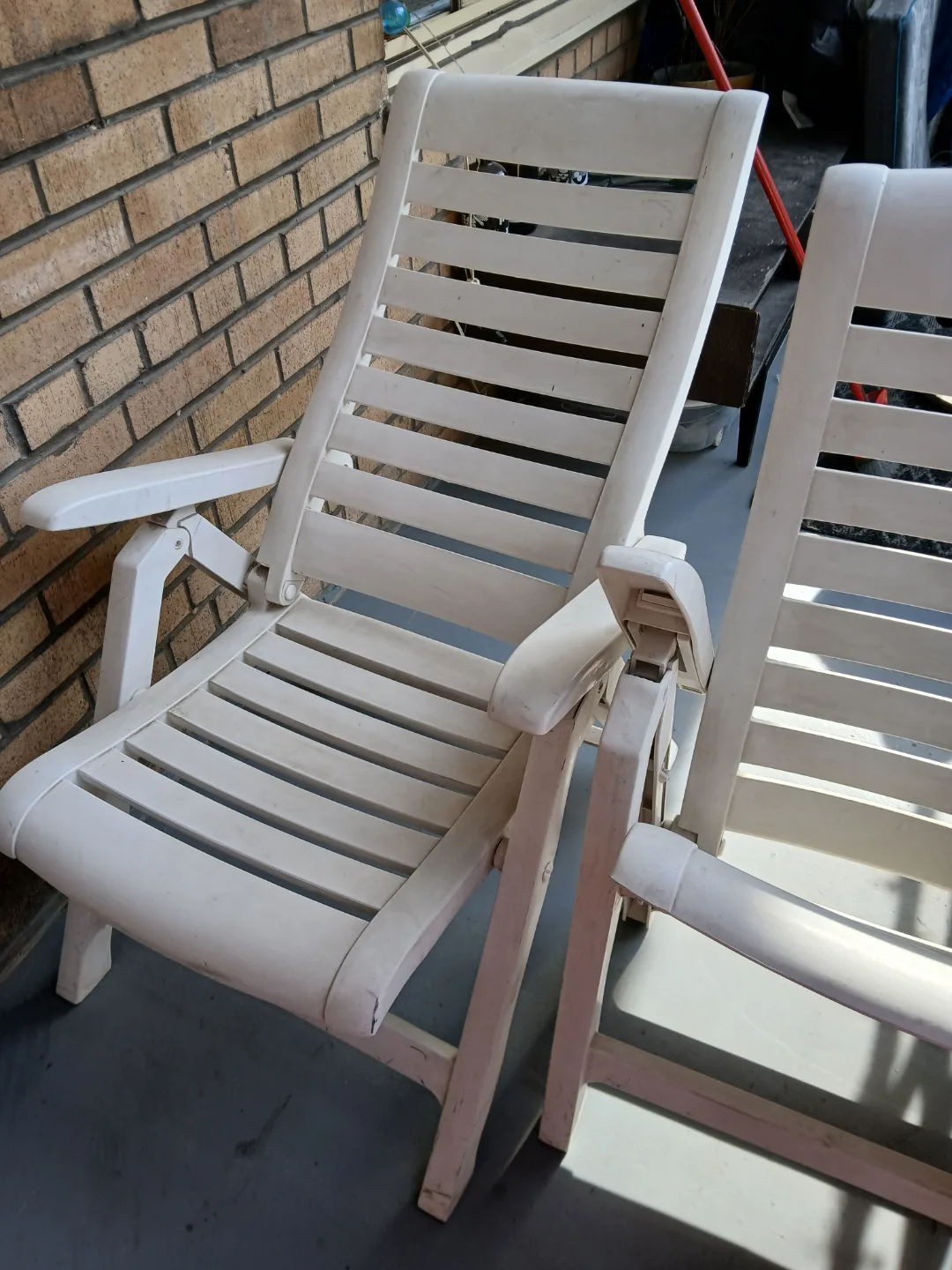 Pair of White Plastic Folding Lounge Chairs image indicator(5)