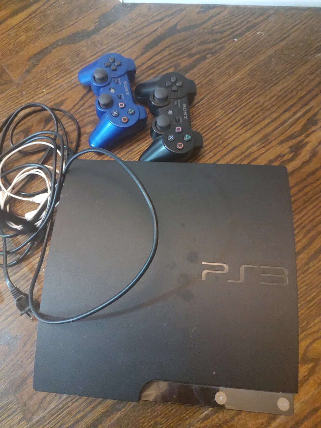 Sony PS3 Console with Two Controllers thumbnail