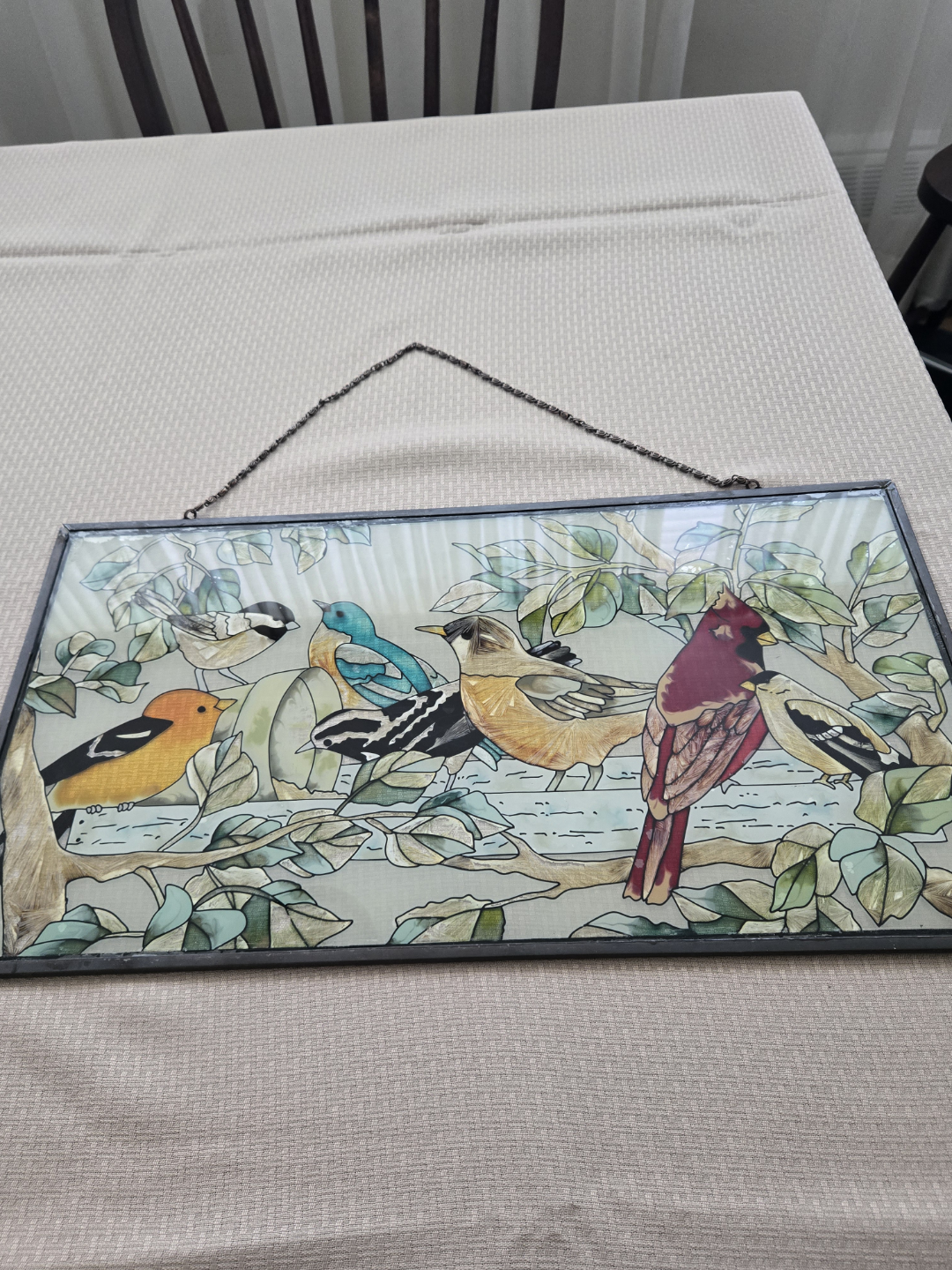 Bird-themed stained glass window hanging
