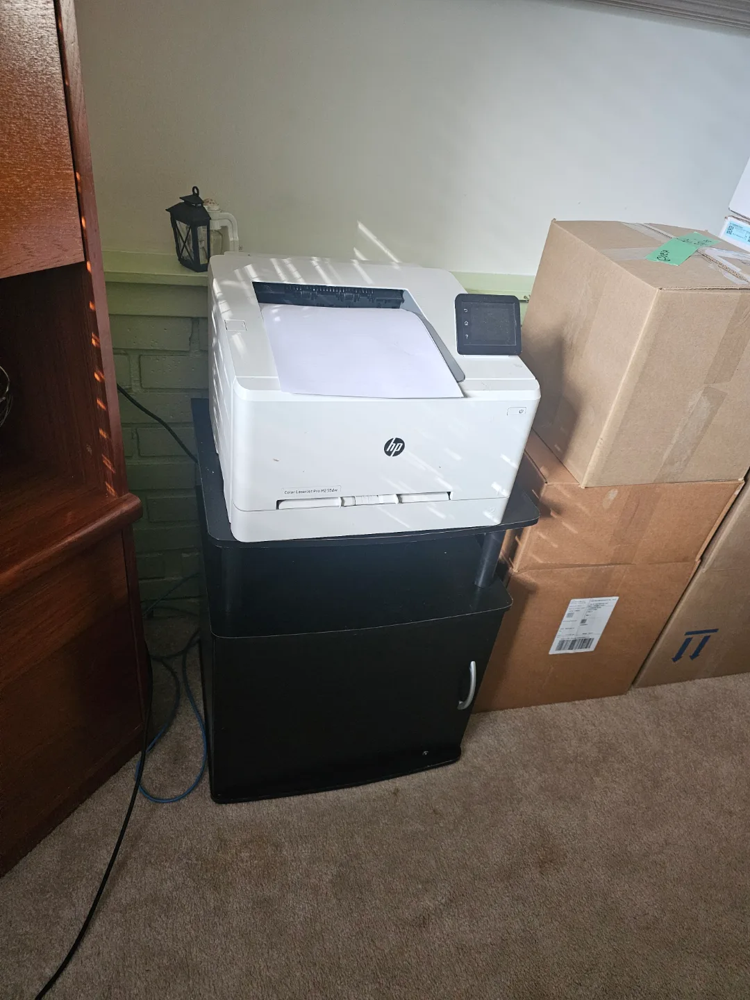 HP Color LaserJet Pro M281fdw Printer, cabinet, and paper thumbnail
