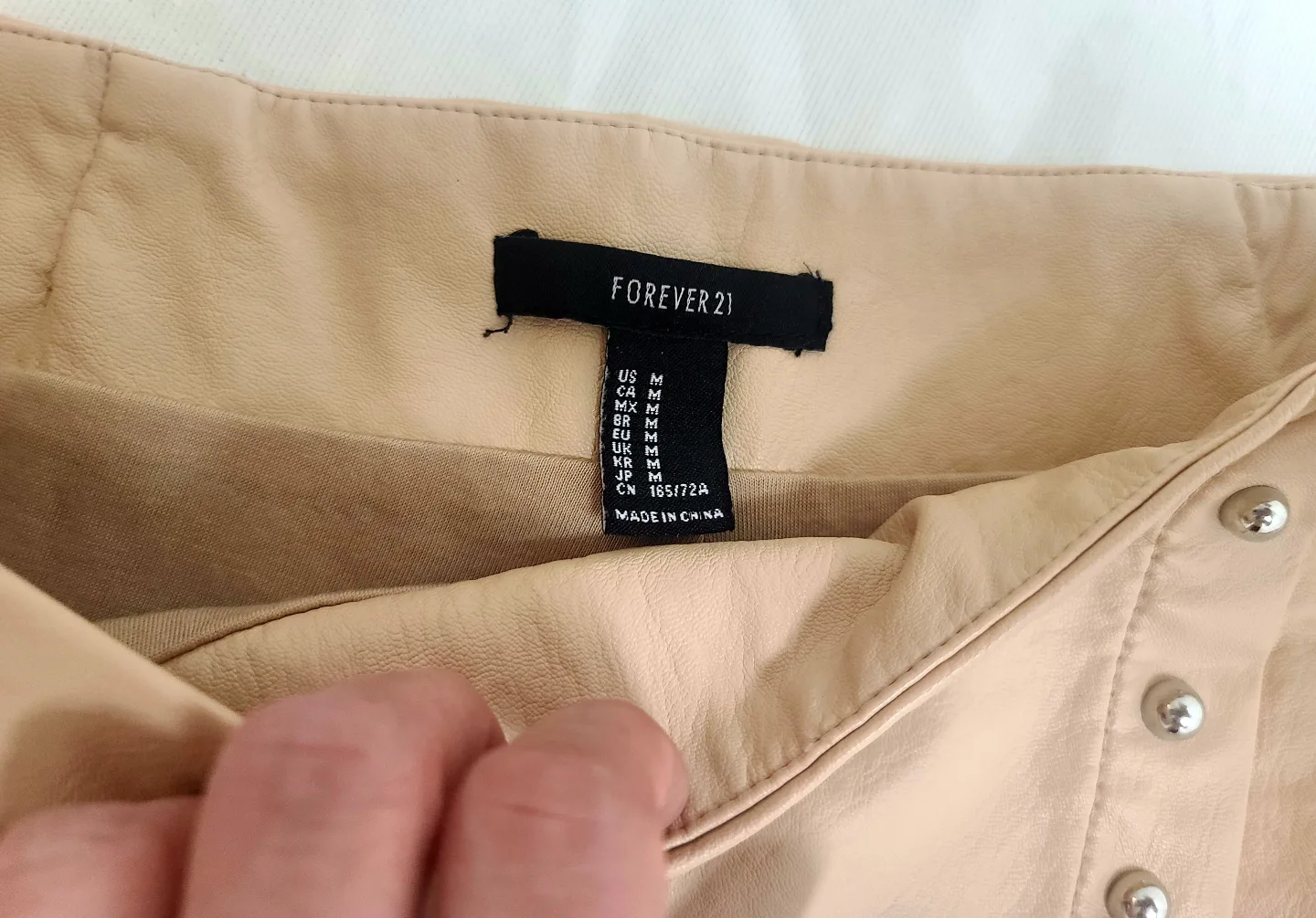 🇨🇦Forever 21 Beige Studded Faux Leather Mini Skirt - Size Medium image indicator(2)