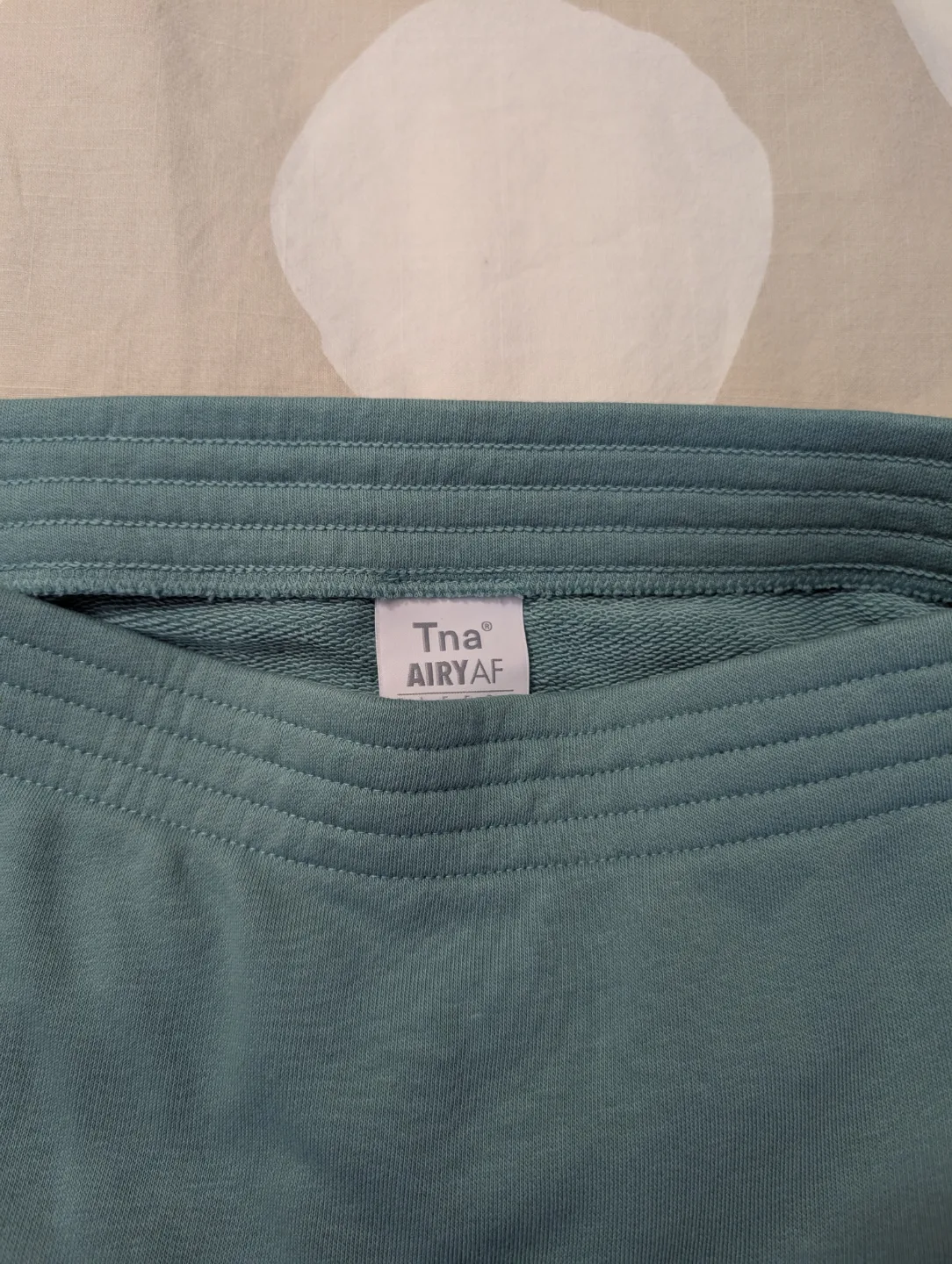 NEW TNA/aritzia teal skirt image indicator(2)