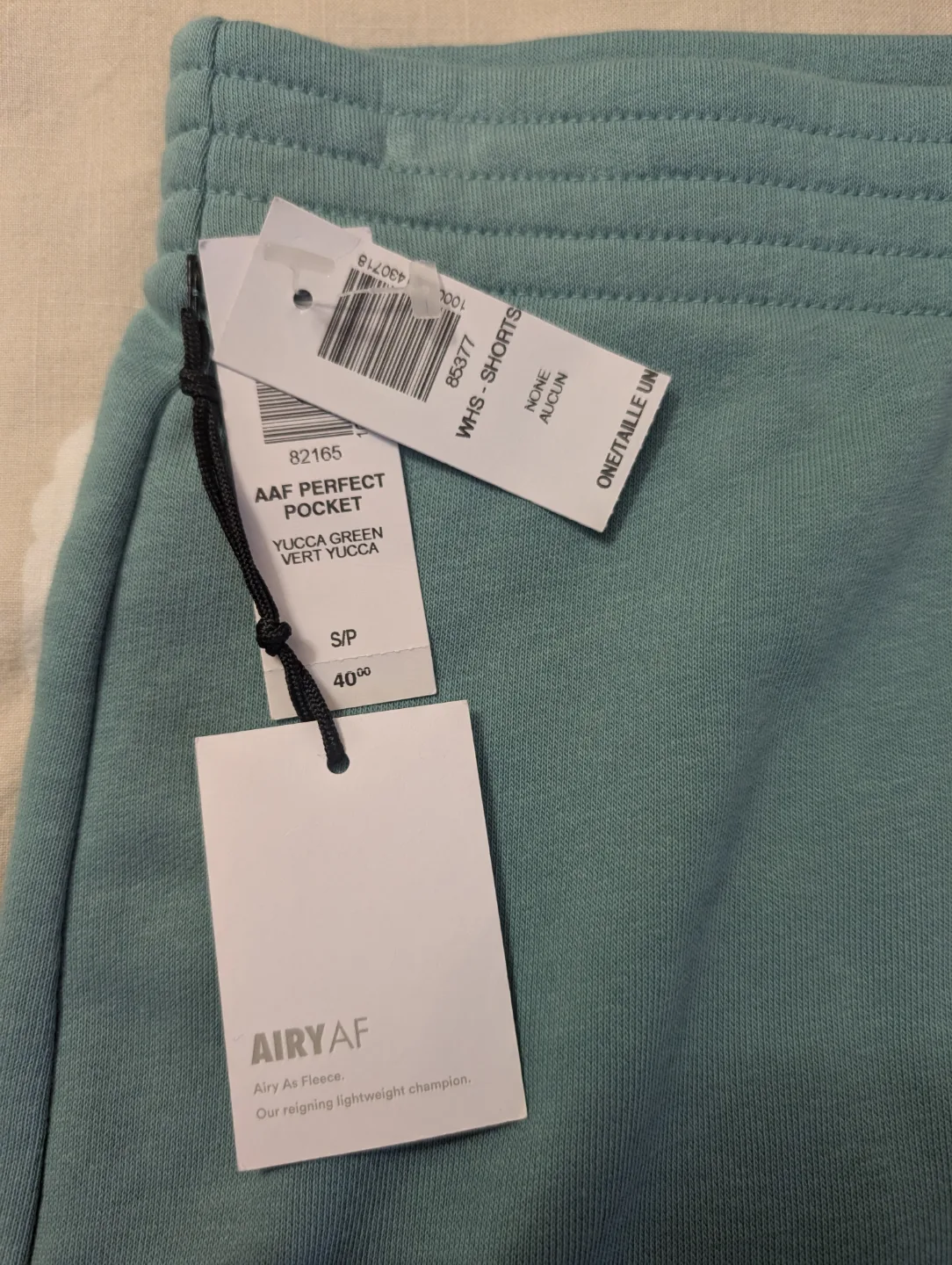 NEW TNA/aritzia teal skirt image indicator(3)
