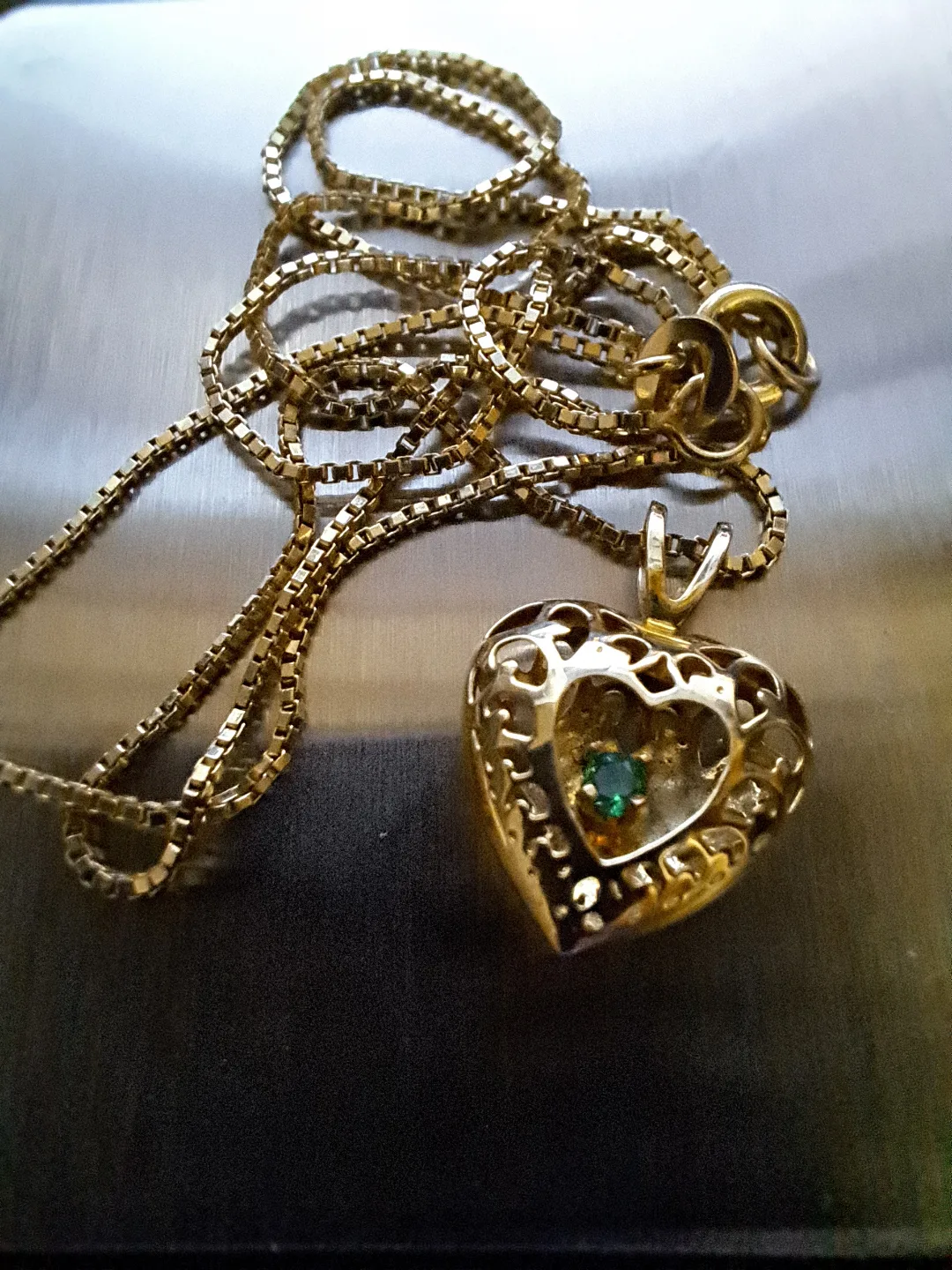 Gold Heart Pendant Necklace with Emerald Accents image indicator(2)