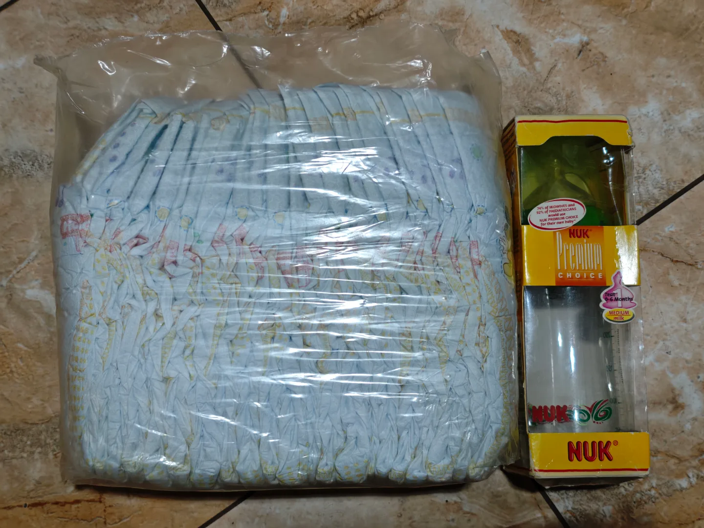 Huggies SnugDry Plus Diapers & NUK Premium Choice Baby Bottle image indicator(2)