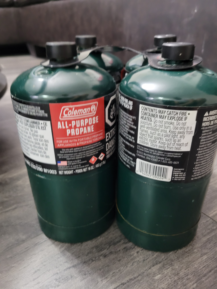 Four Coleman 16 oz Propane Tanks with Carrier - photo 2