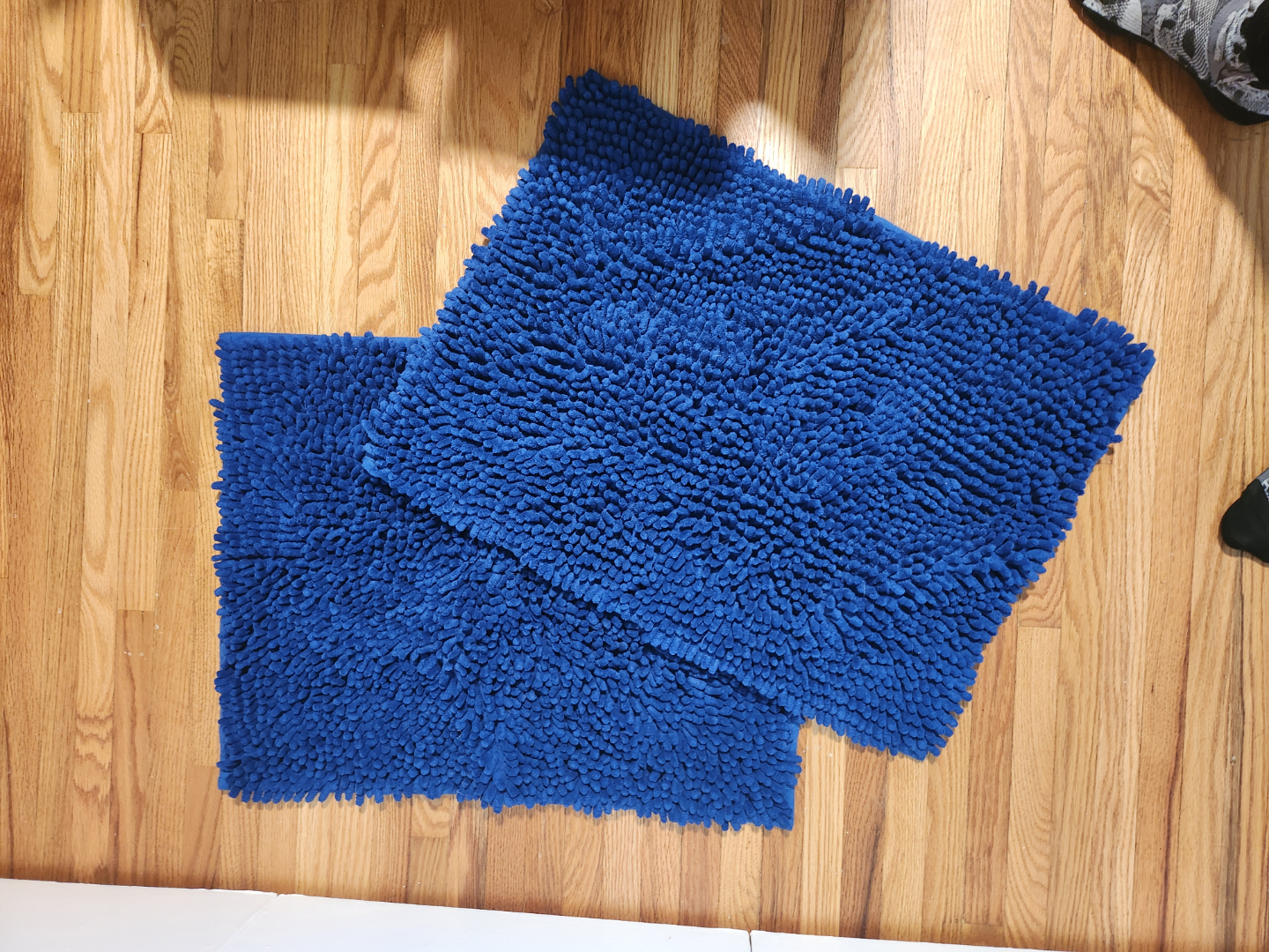 Two Blue Bath Mats