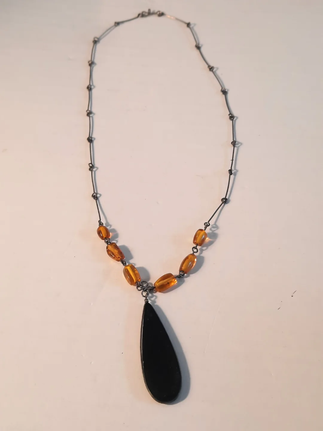 vintage hand made pendant with amber black and brown thumbnail