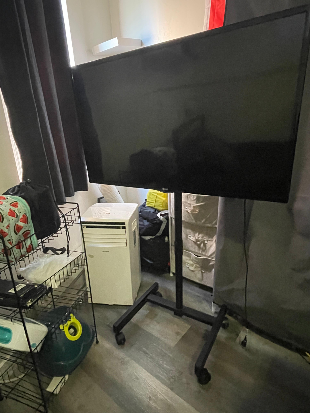 42 inch LG TV on Rolling Stand