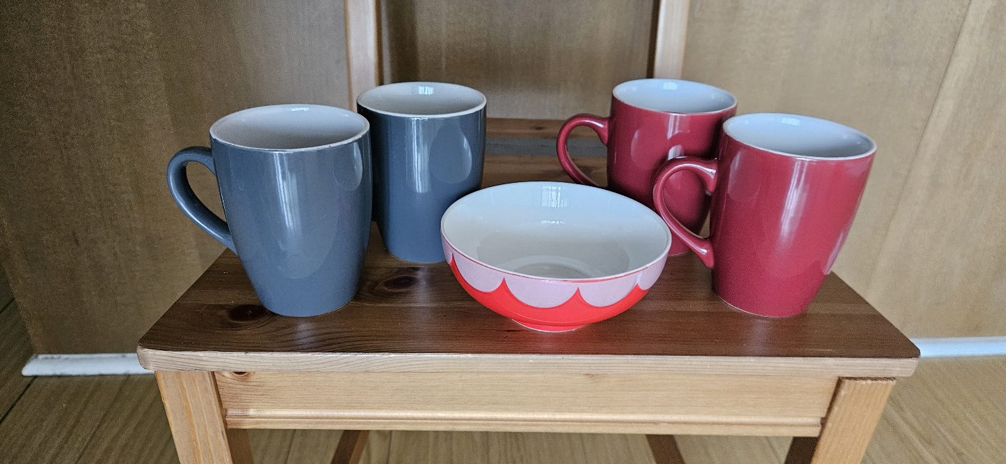 Set of four mugs and a bowl
