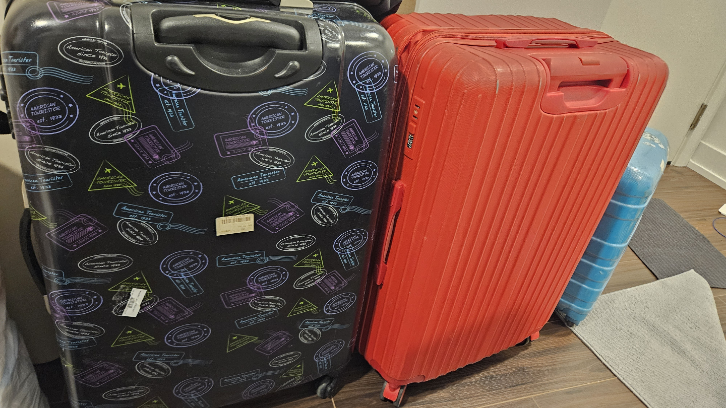 Two Suitcases - American Tourister & Red Suitcase