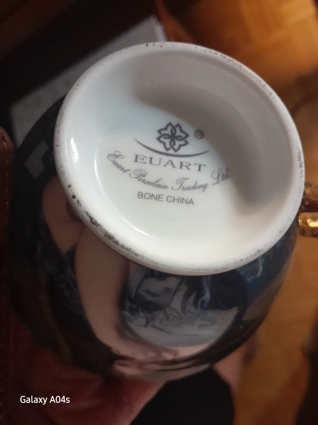 Elegant Bone China Teacup with Gold Accents image indicator(4)