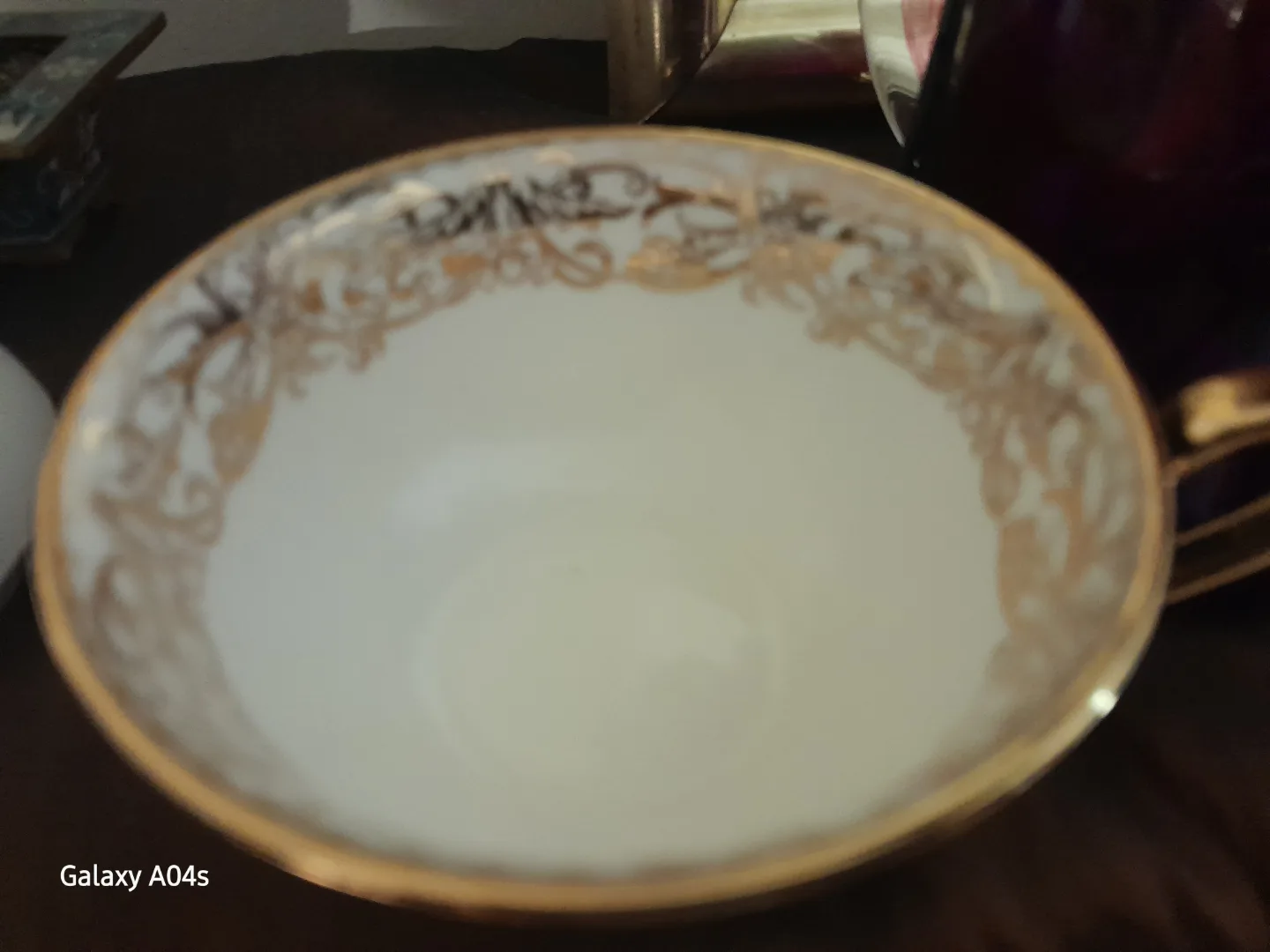 Elegant Bone China Teacup with Gold Accents image indicator(2)