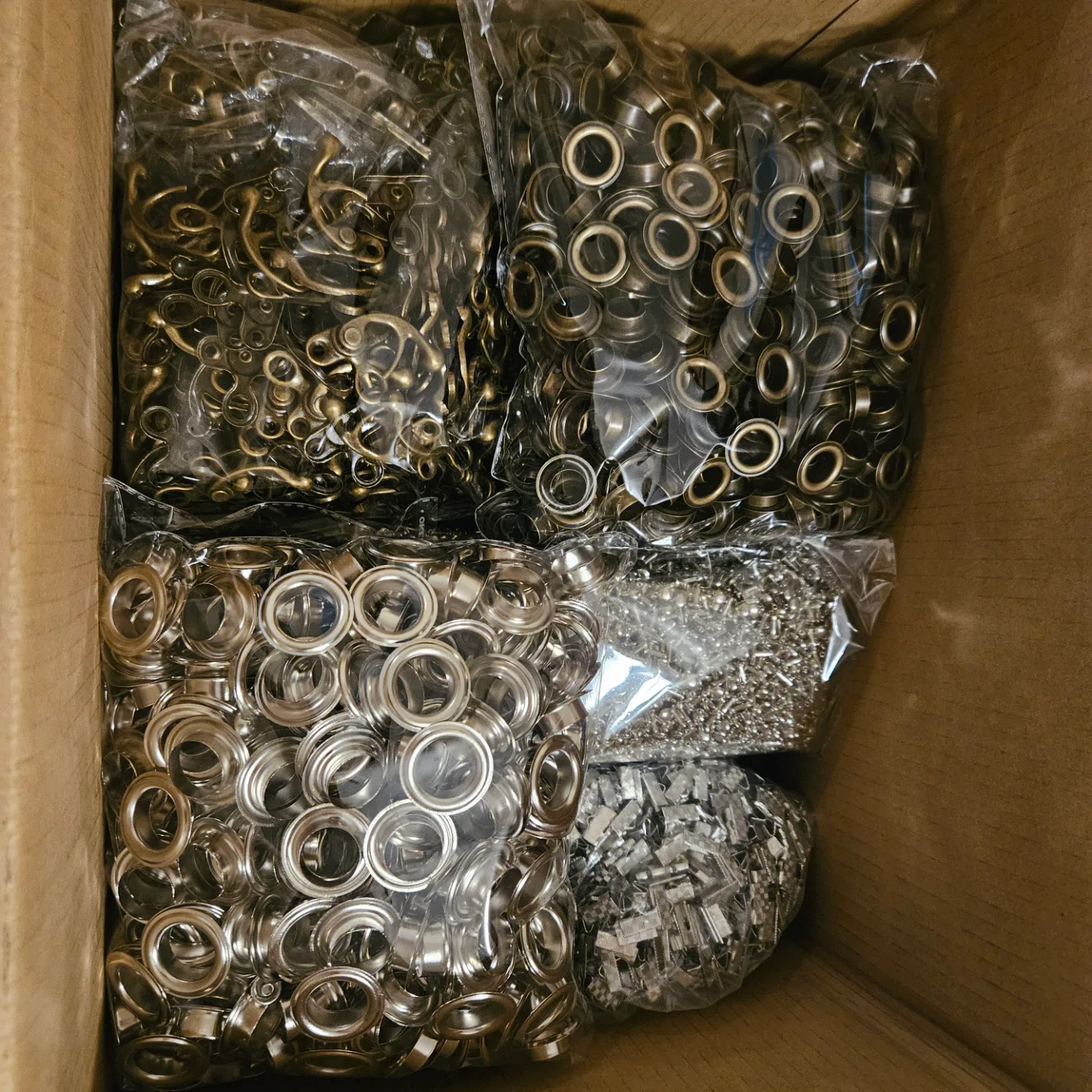 Bulk lot of metal eyelets, hooks, and other hardware thumbnail