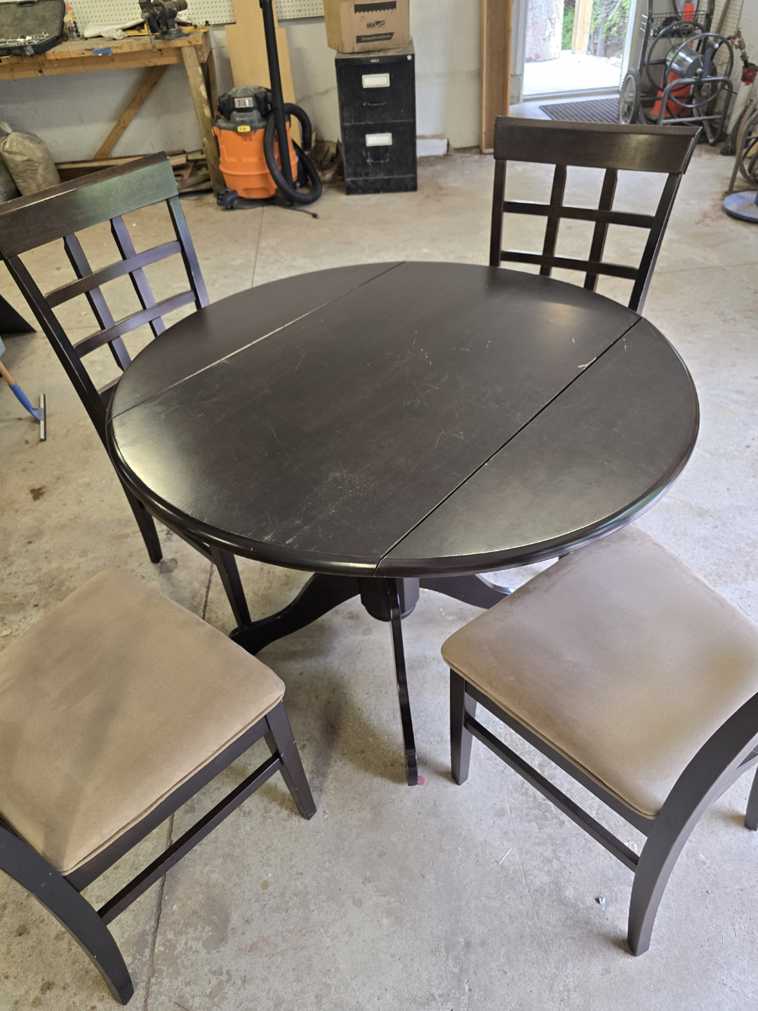 Dark Brown Drop-Leaf Pedestal Table and Four Cushion Chairs