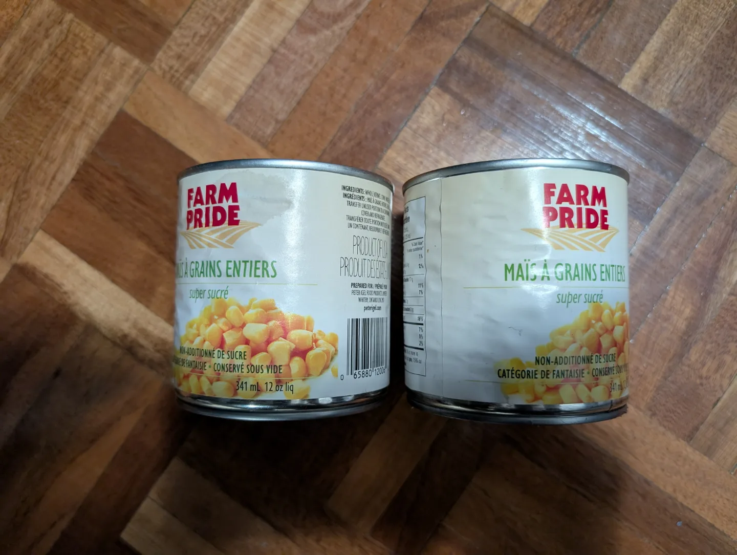 Two cans of Farm Pride whole kernel corn thumbnail