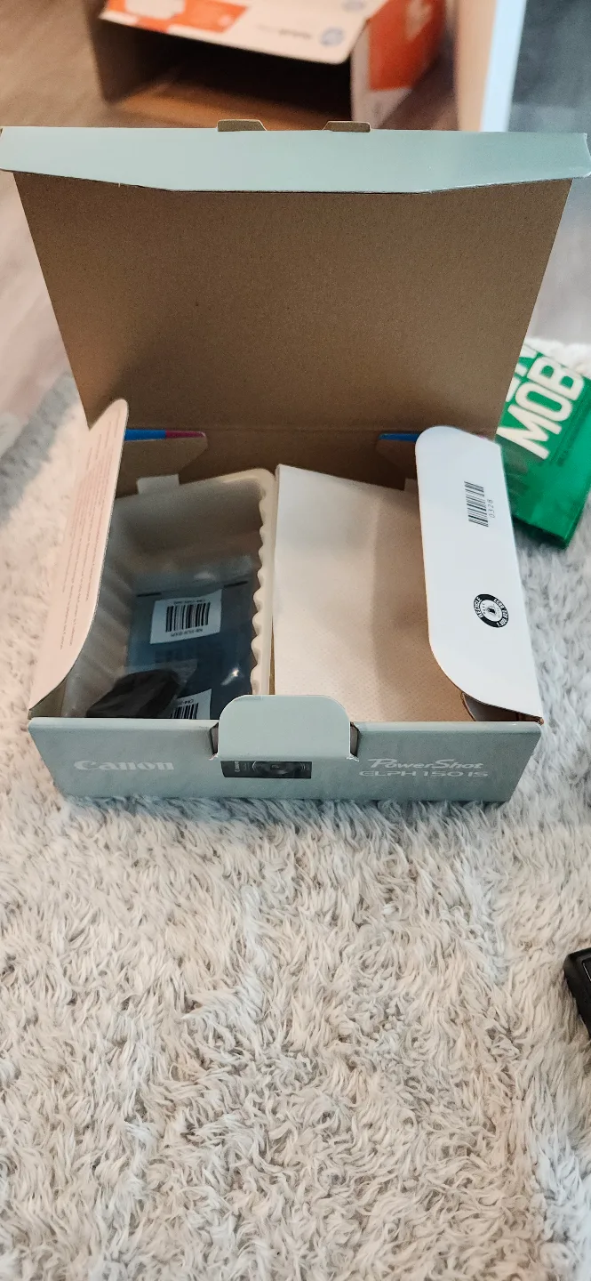 Barely used Canon Powershot ELPH 150 IS with lots of accessories image indicator(5)