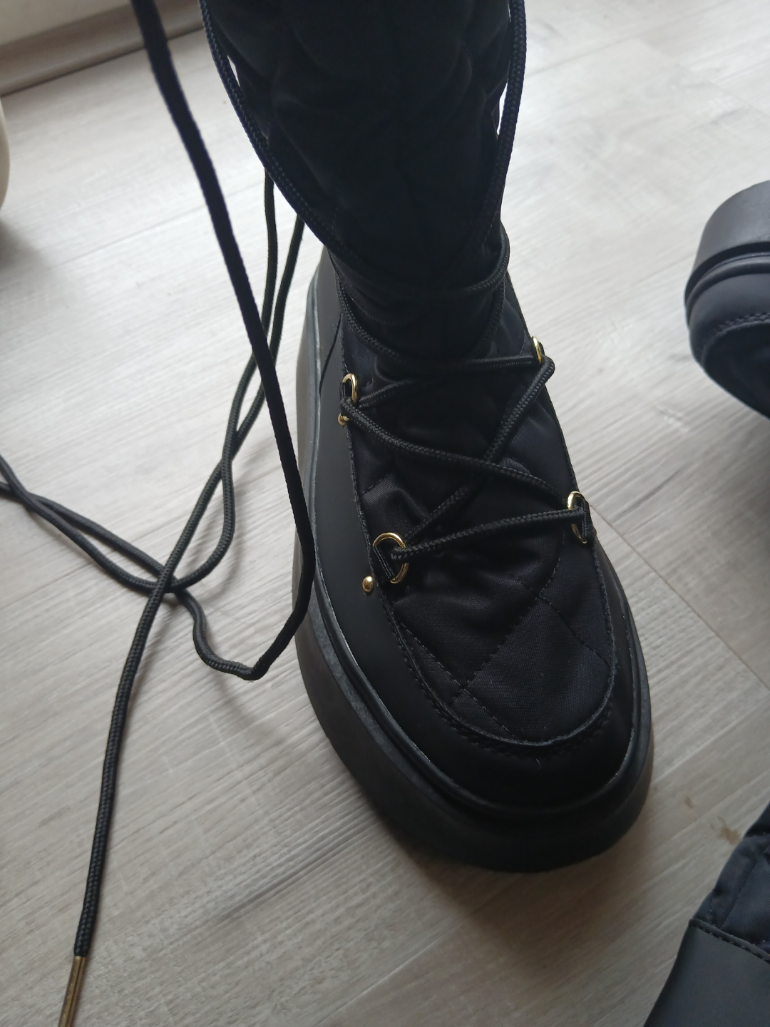 Black Quilted Snow Boots with Gold Accents