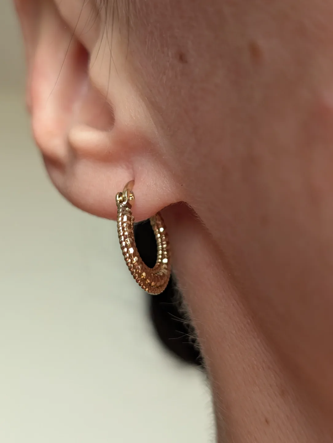 Small Gold Tone textured hoop earrings image indicator(8)