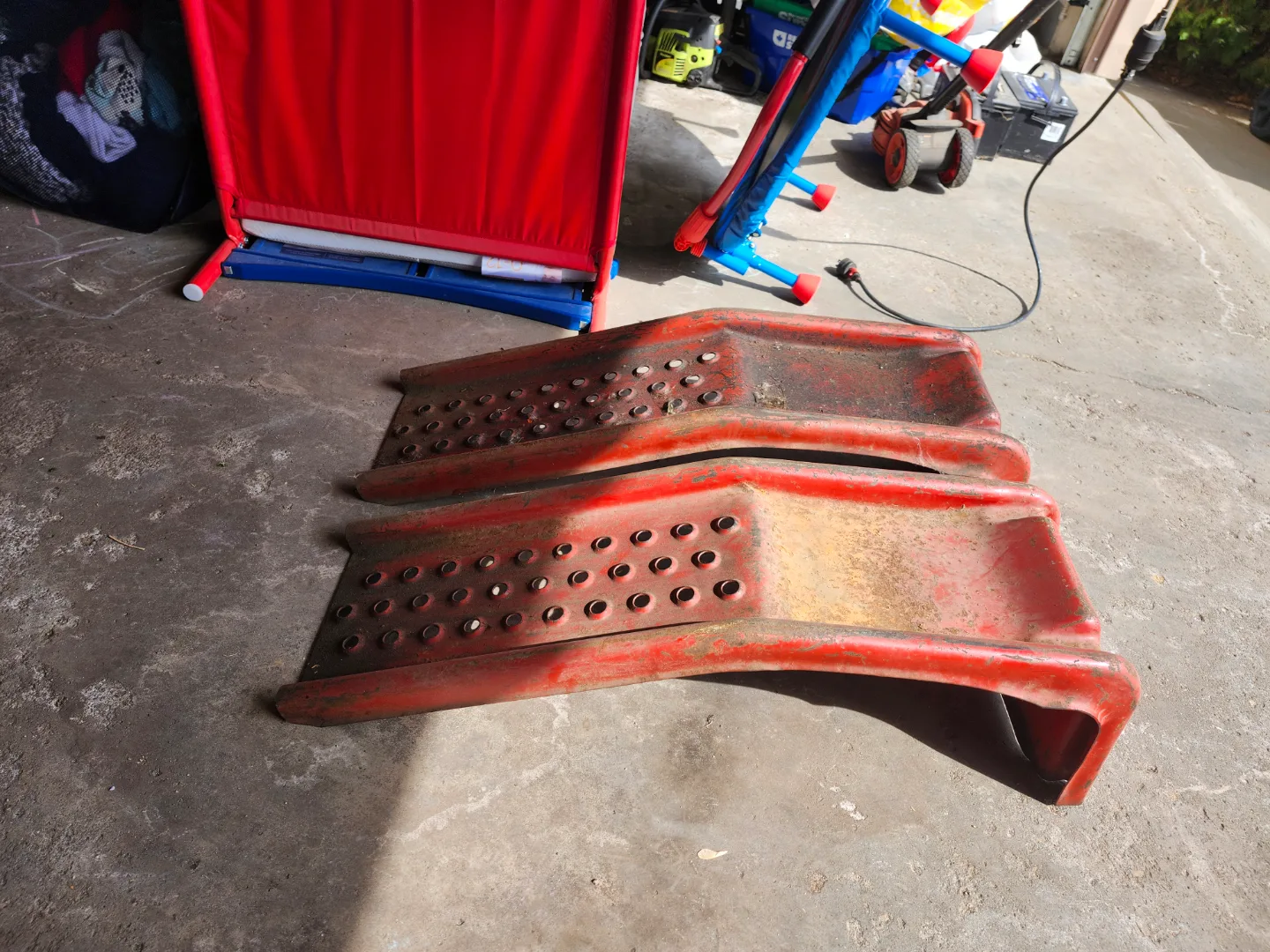 Pair of Used Red Metal Vehicle Ramps