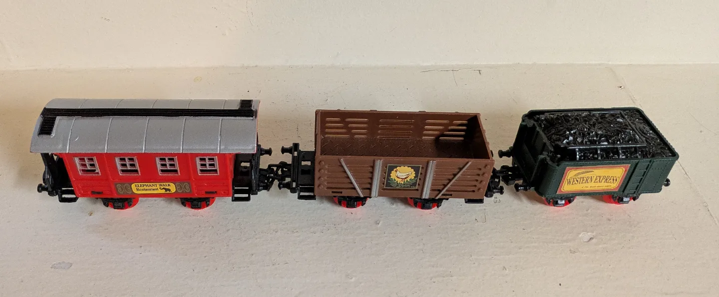 Vintage Toy Train with Three Cars image indicator(2)