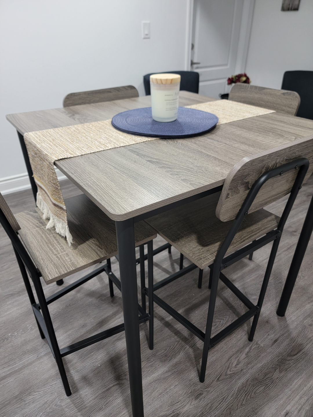 Square dining table with four chairs