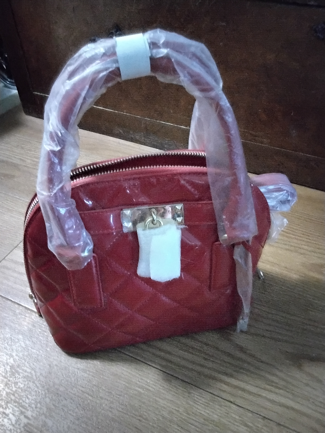 Red quilted satchel handbag