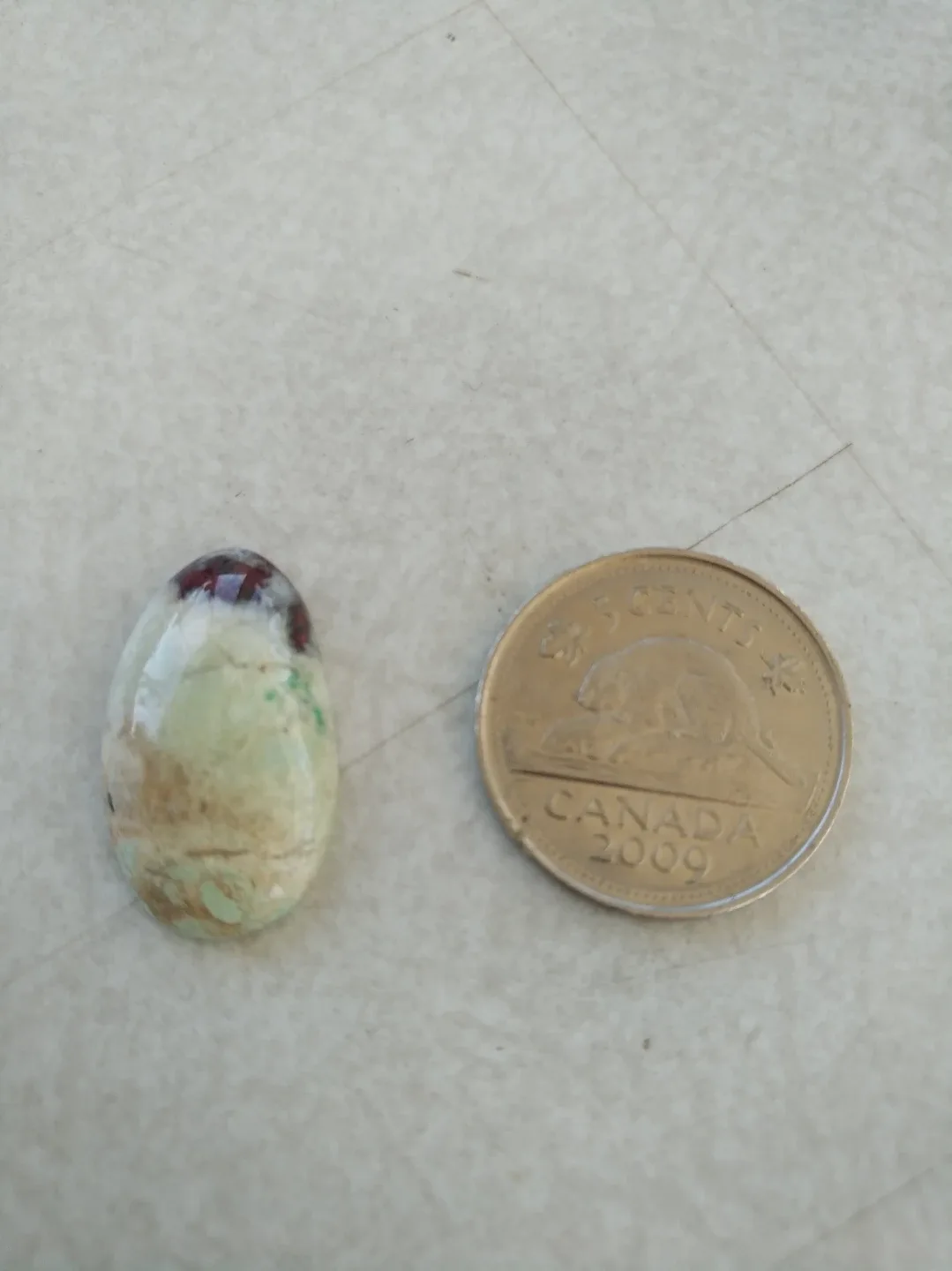 Campbellite (Rare), Oval Shape, Red, Green & Brown Flecks thumbnail