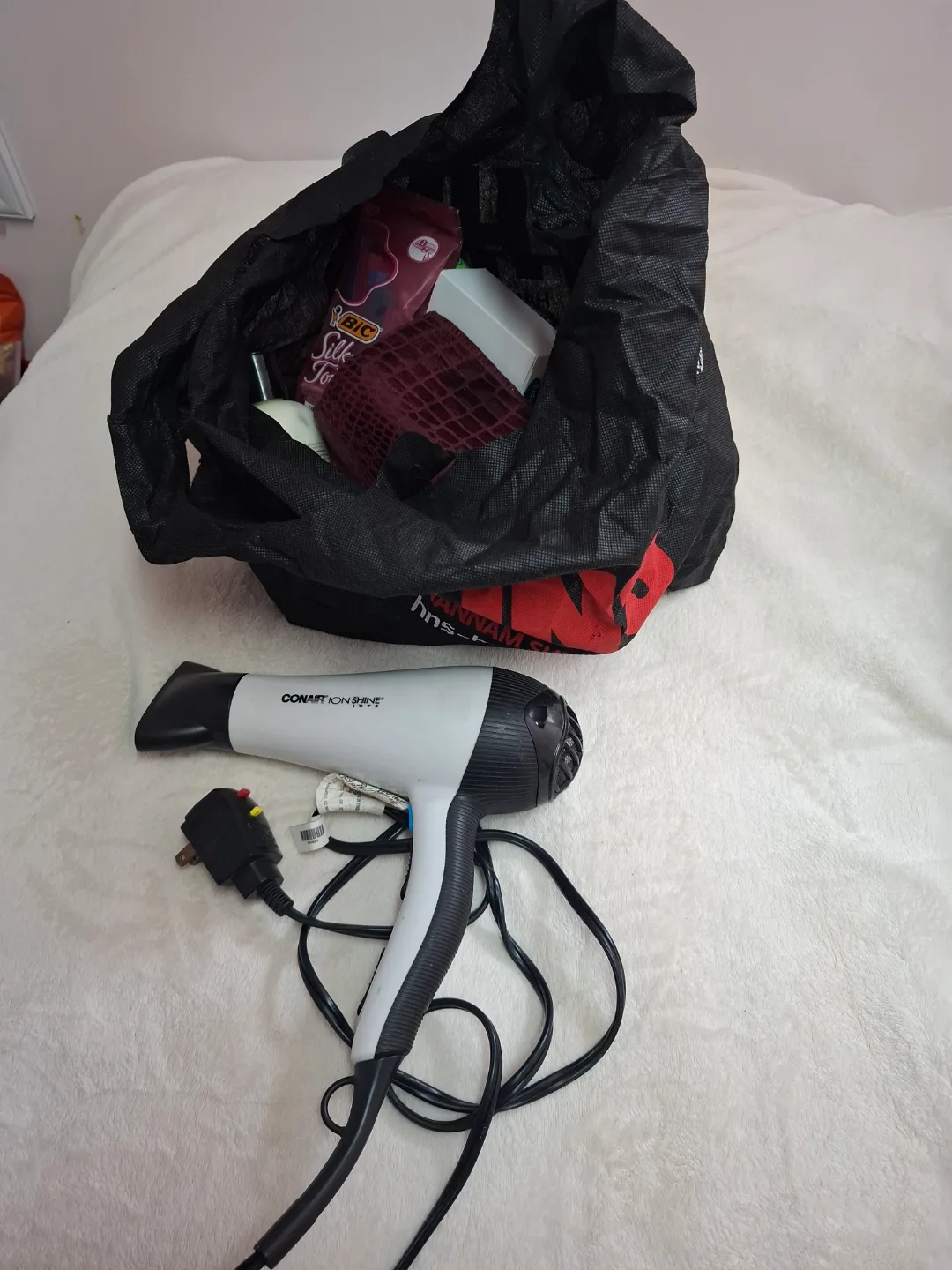 Hair Dryer and some bath products thumbnail