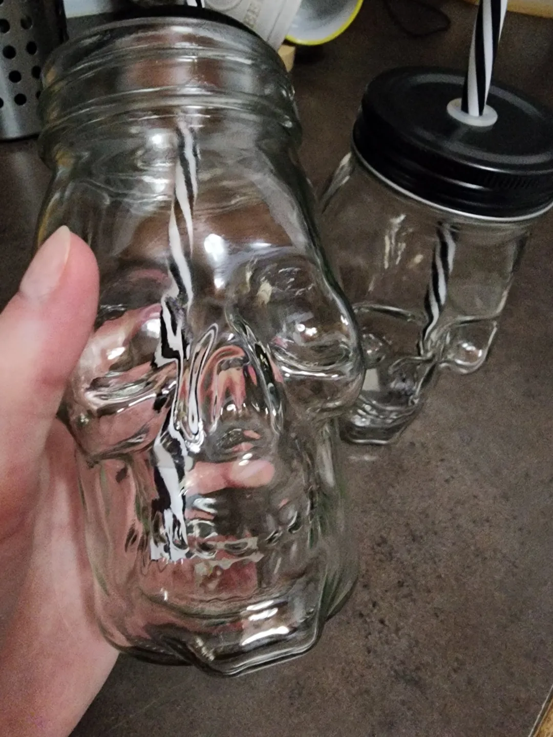 Two Skull-Shaped Mason Jar Glasses with Lids and Straws thumbnail