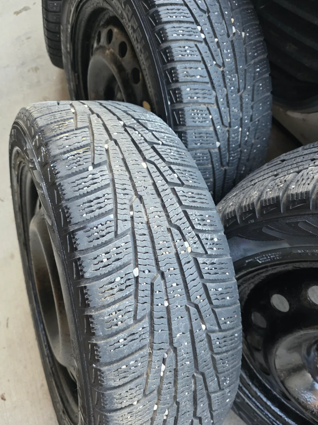 Four Used Nokian Hakkapeliitta R2 Winter Tires on Steel Rims image indicator(6)