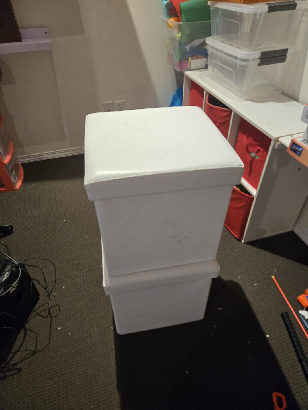 Two White Storage Ottomans and Orange Side Table