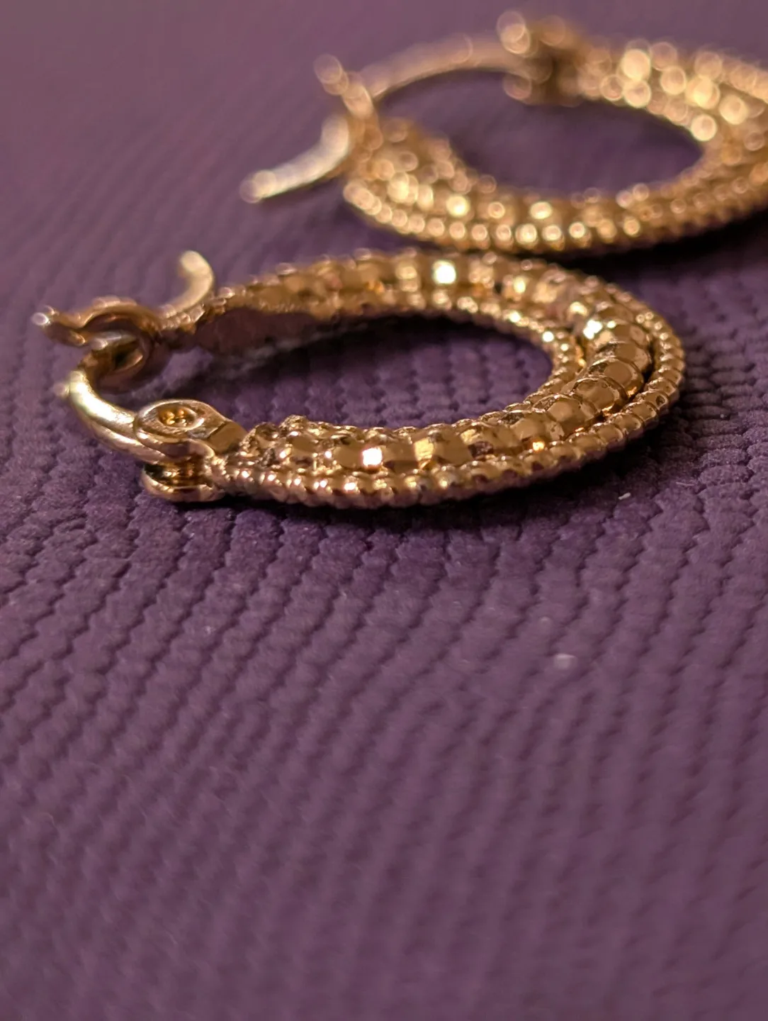 Small Gold Tone textured hoop earrings image indicator(4)