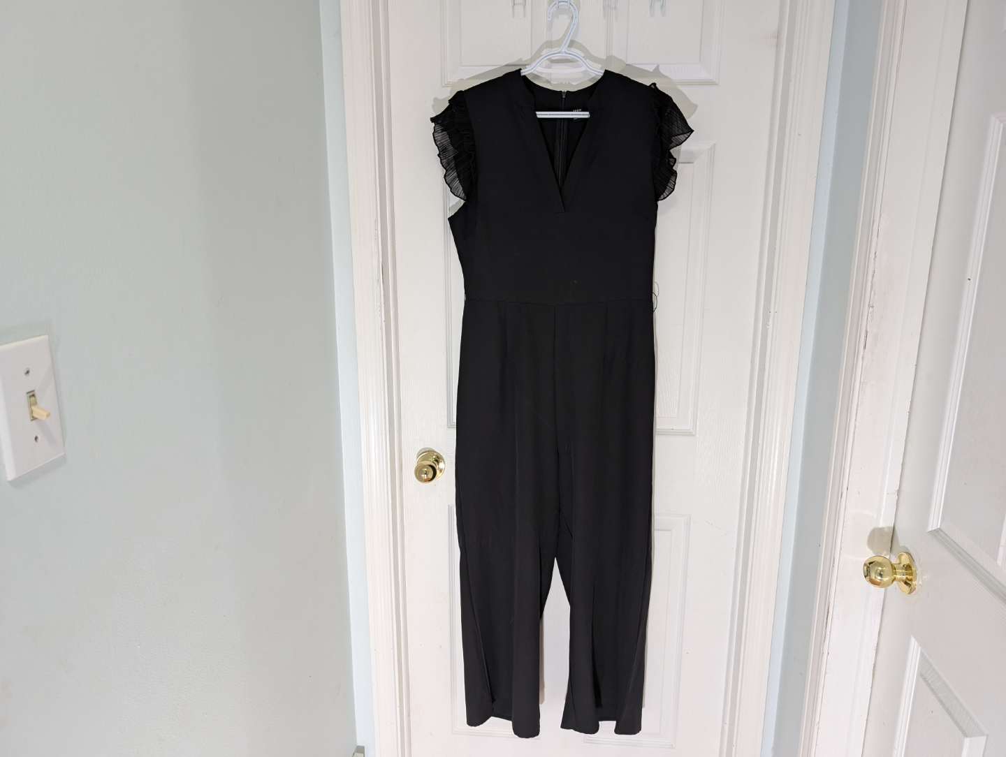 Black V-Neck Jumpsuit with Subtle Ruffle Sleeves - photo 2