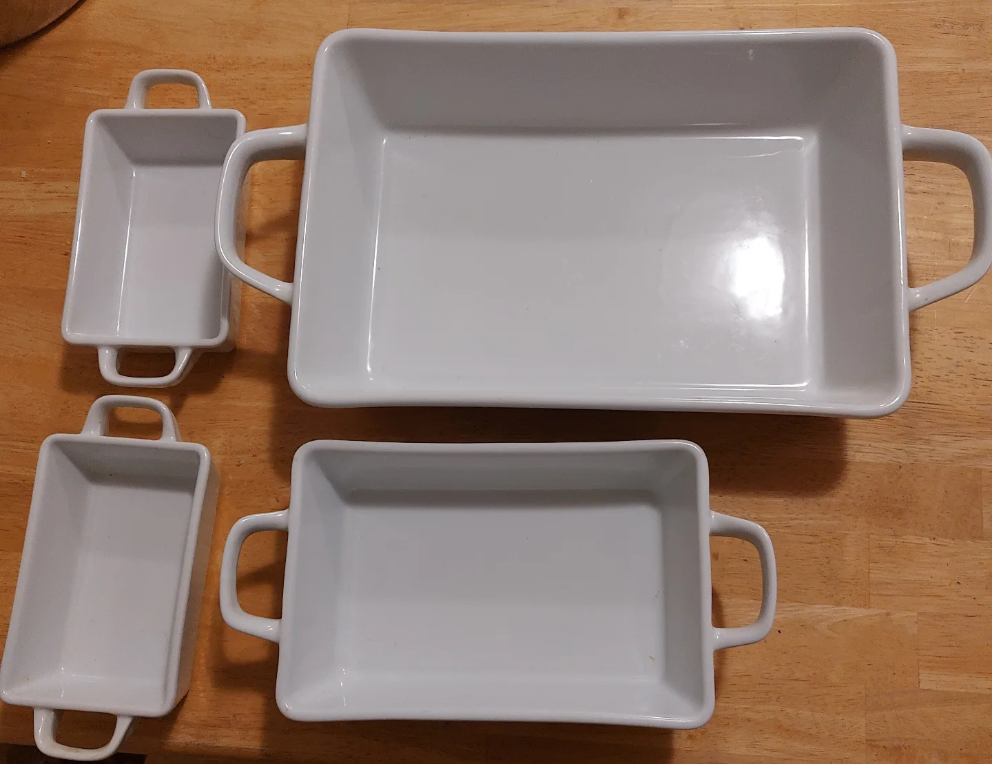 Set of four white ceramic baking dishes thumbnail
