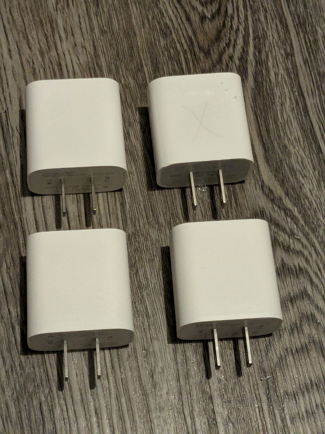 Four Apple 20W USB-C Power Adapters